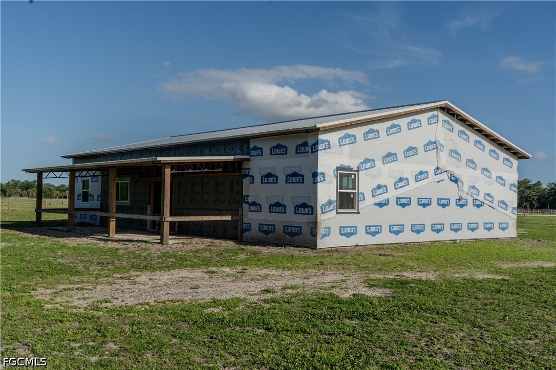 595 Norris Road LaBelle, FL 33935 - Photo 12 of 22 a view of a house with a yard