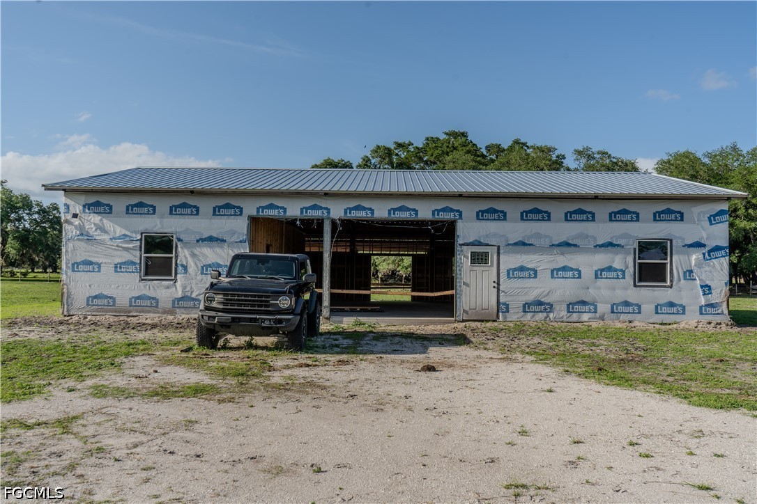 595 Norris Road LaBelle, FL 33935 - Photo 8 of 22 a view of a car park in front of house