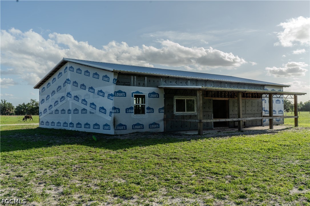 595 Norris Road LaBelle, FL 33935 - Photo 10 of 22 a view of a house with a yard