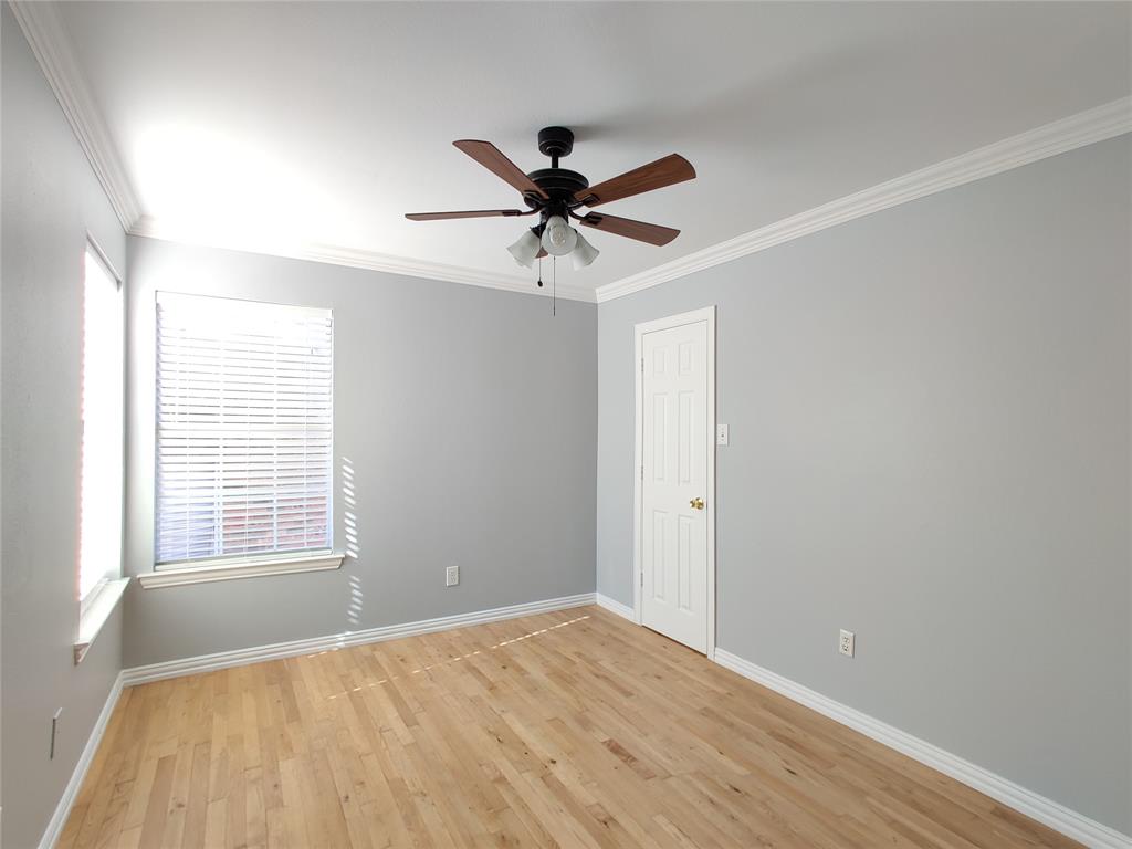 1200 St Regis Drive Irving, TX 75038 - Photo 14 of 17 a view of a livingroom with a window and a ceiling fan
