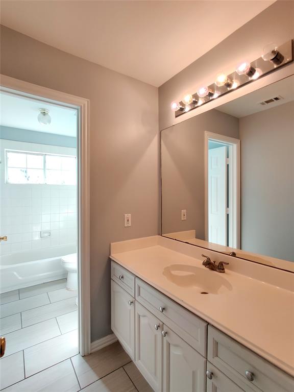 1200 St Regis Drive Irving, TX 75038 - Photo 15 of 17 a bathroom with a sink a vanity and a mirror