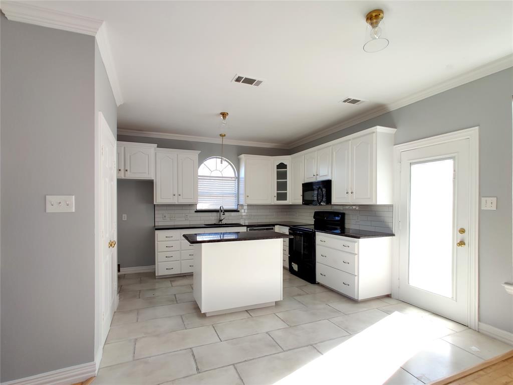 1200 St Regis Drive Irving, TX 75038 - Photo 6 of 17 a kitchen with stainless steel appliances a sink a stove a refrigerator and cabinets