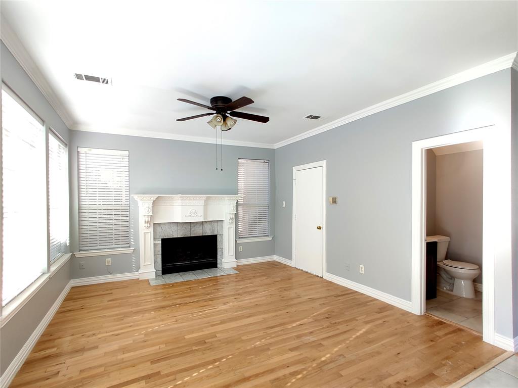 1200 St Regis Drive Irving, TX 75038 - Photo 7 of 17 a view of an empty room with a fireplace and a window