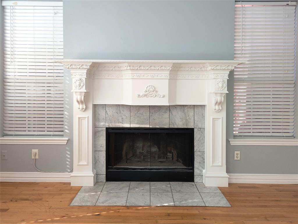 1200 St Regis Drive Irving, TX 75038 - Photo 8 of 17 a living room with a fireplace