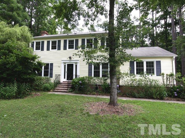413 Tinkerbell Road Chapel Hill, NC 27517 - Photo 1 of 5 a front view of a house with a yard and green space