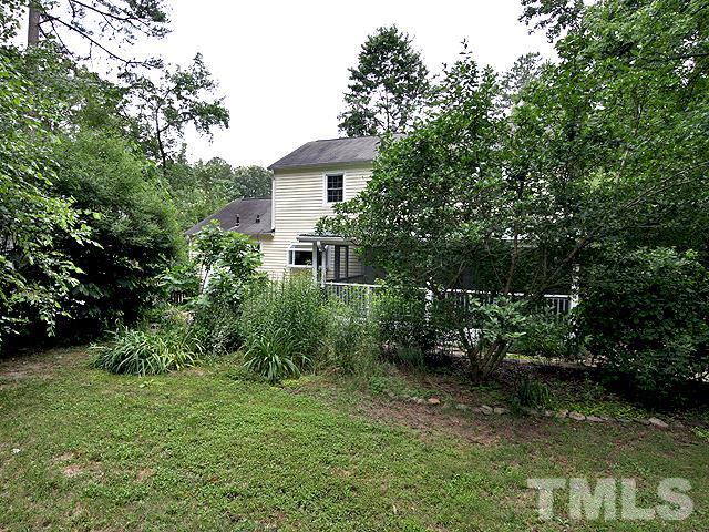 413 Tinkerbell Road Chapel Hill, NC 27517 - Photo 5 of 5 a view of a house with a yard and a tree