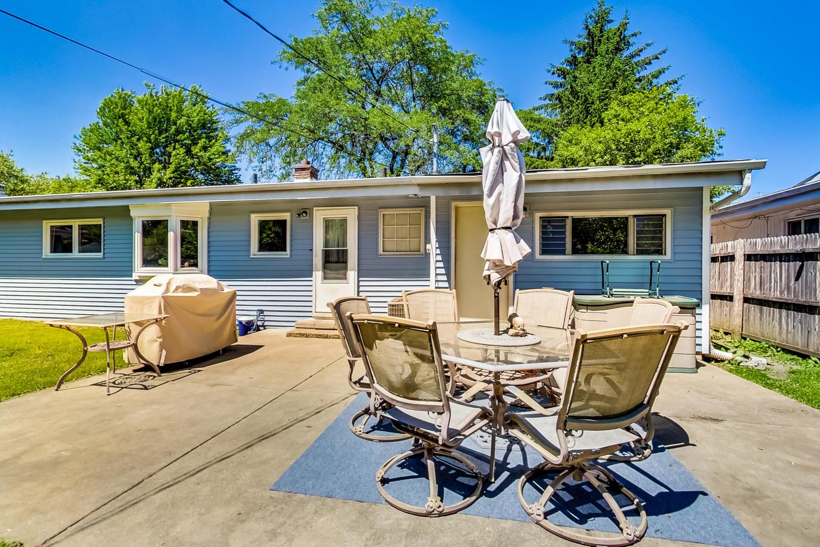 661 East Baldwin Road Palatine, IL 60074 - Photo 24 of 26 a view of a house with a patio and a yard
