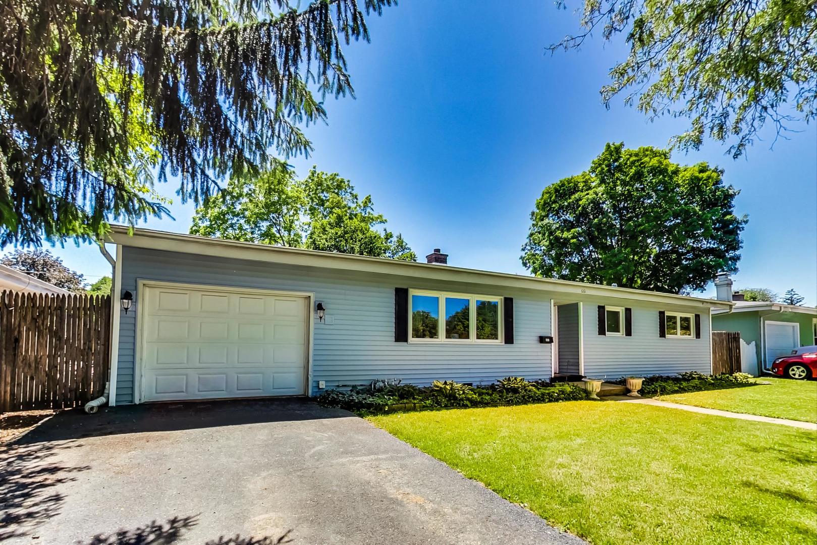 661 East Baldwin Road Palatine, IL 60074 - Photo 3 of 26 a front view of a house with a yard
