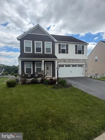 front view of a house with a garden