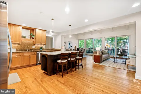 a kitchen with lots of counter top space and dining table