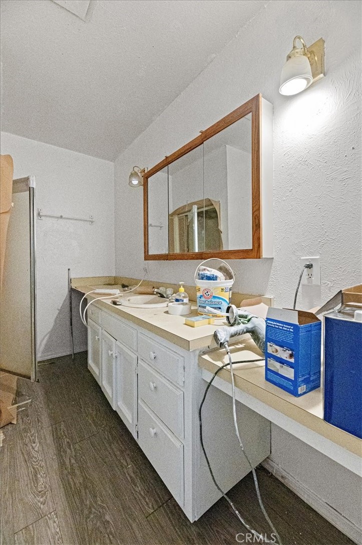 44340 Foxton Avenue Lancaster, CA 93535 - Photo 17 of 25 a spacious bathroom with a double vanity sink and a mirror