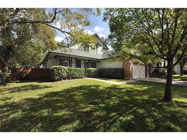 12515 Turkey Ridge Court Austin, TX 78729 - Photo 1 of 1 a front view of a house with a yard