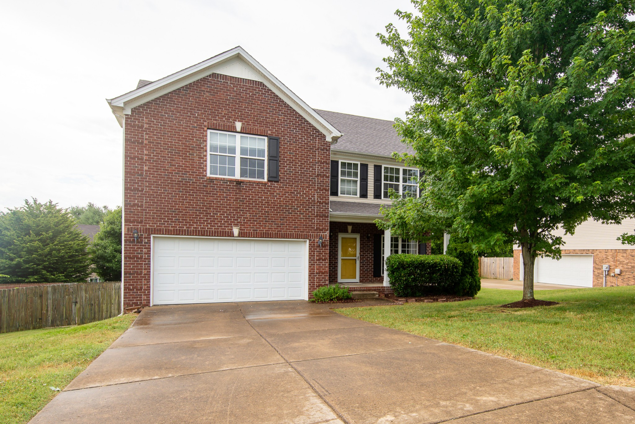 1910 Portway Road Spring Hill, TN 37174 - Photo 1 of 20 a front view of a house with a yard and trees