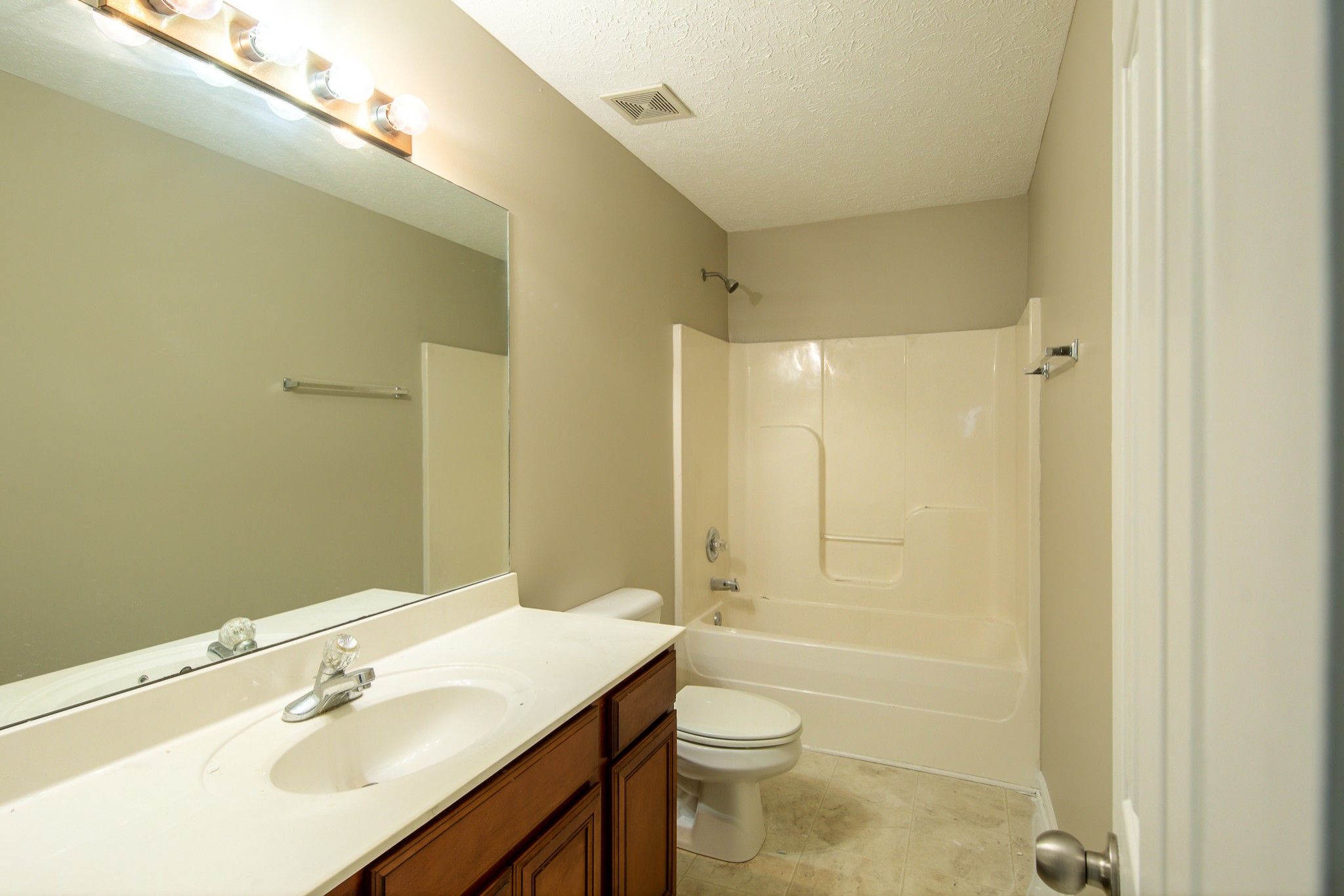 1910 Portway Road Spring Hill, TN 37174 - Photo 17 of 20 a bathroom with a sink a toilet and shower