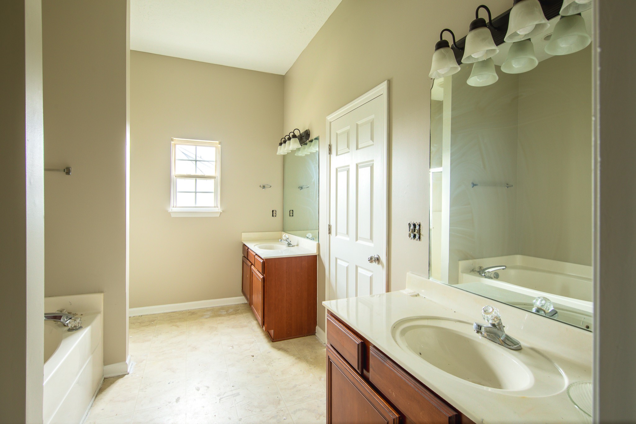 1910 Portway Road Spring Hill, TN 37174 - Photo 19 of 20 a bathroom with a granite countertop sink a bathtub and shower