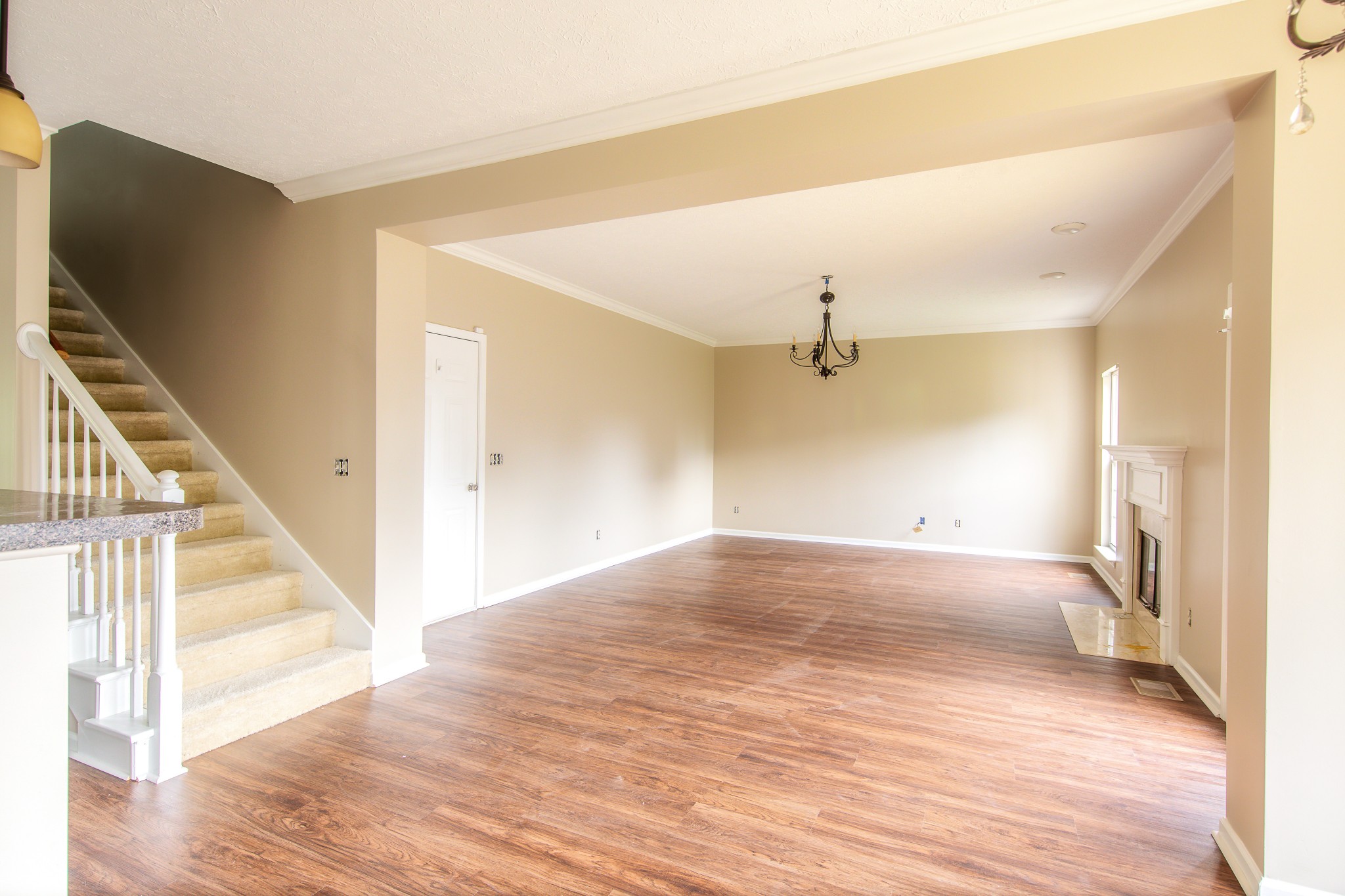 1910 Portway Road Spring Hill, TN 37174 - Photo 6 of 20 a view of a hallway with wooden floor and staircase