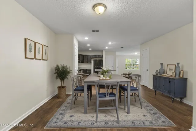 a view of a dining room with furniture