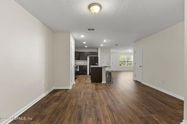 a view of kitchen with wooden floor