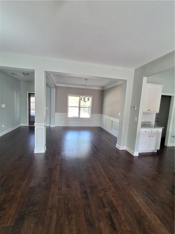 110 Spetchley Way Bogart, GA 30622 - Photo 3 of 13 a view of an empty room with wooden floor and a window