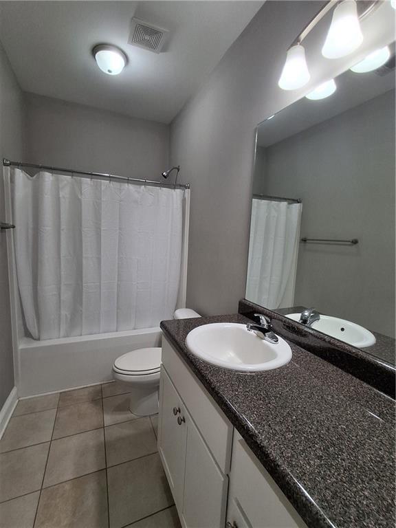110 Spetchley Way Bogart, GA 30622 - Photo 6 of 13 a bathroom with a granite countertop sink and a mirror
