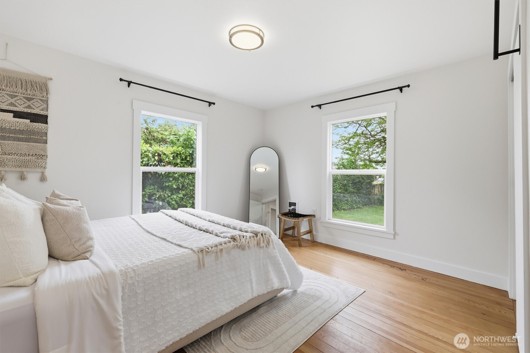 1651 Southwest 114th Street Seattle, WA 98146 - Photo 23 of 37 a bedroom with a bed and a window