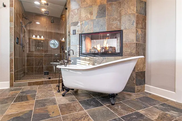 a large tub sitting next to a bathroom