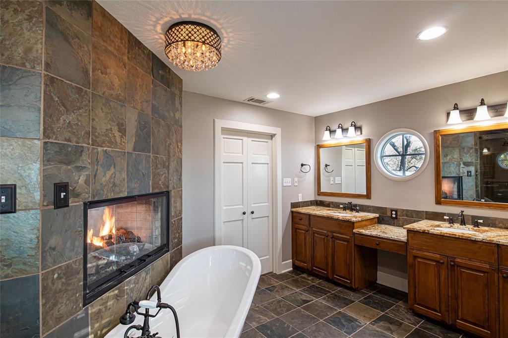 9310 Merritt Road Rowlett, TX 75089 - Photo 13 of 40 a kitchen with stainless steel appliances granite countertop a stove a sink and a microwave
