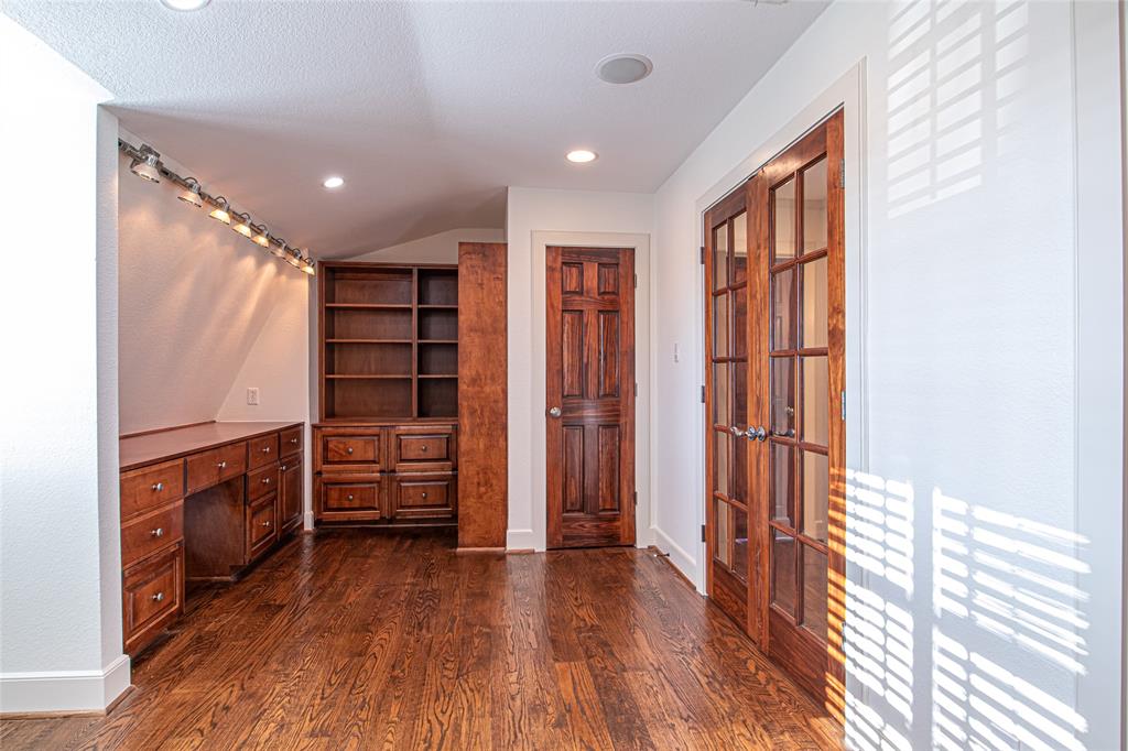 9310 Merritt Road Rowlett, TX 75089 - Photo 19 of 40 a view of walk in closet with clothes and shoes