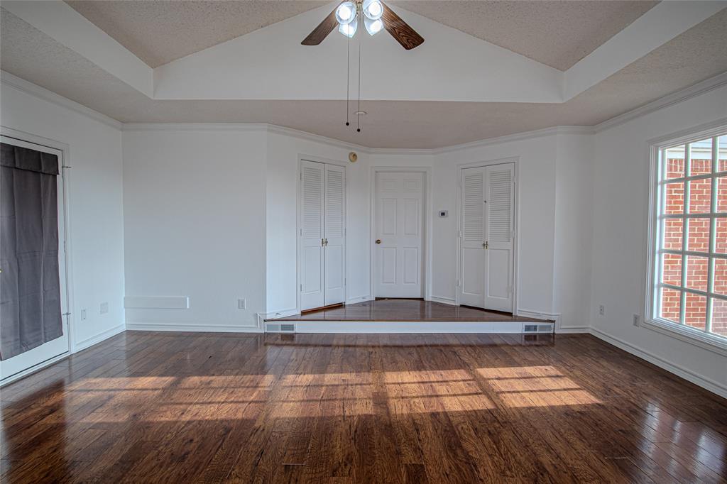 9310 Merritt Road Rowlett, TX 75089 - Photo 20 of 40 a view of a livingroom with a ceiling fan and window