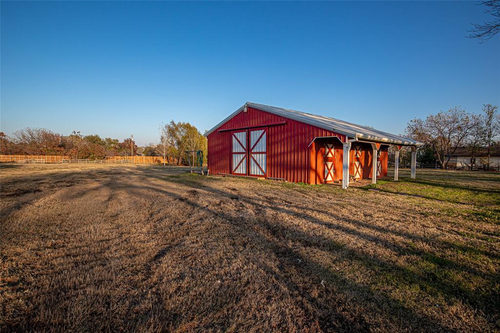 9310 Merritt Road Rowlett, TX 75089 - Photo 3 of 40 a view of a house with a yard