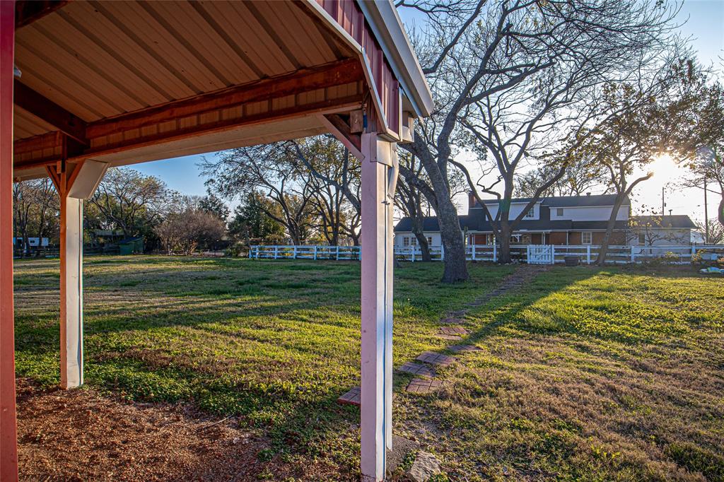 9310 Merritt Road Rowlett, TX 75089 - Photo 34 of 40 a view of a backyard with a large tree