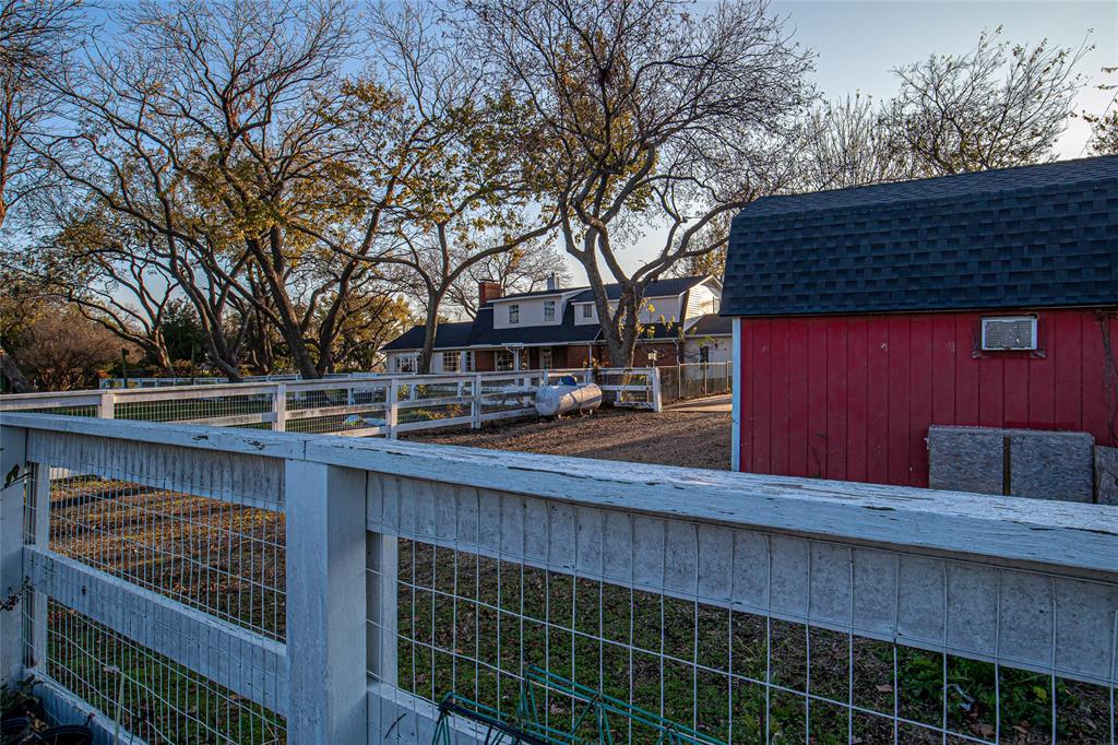 9310 Merritt Road Rowlett, TX 75089 - Photo 35 of 40 a wooden bench sitting in front of a building
