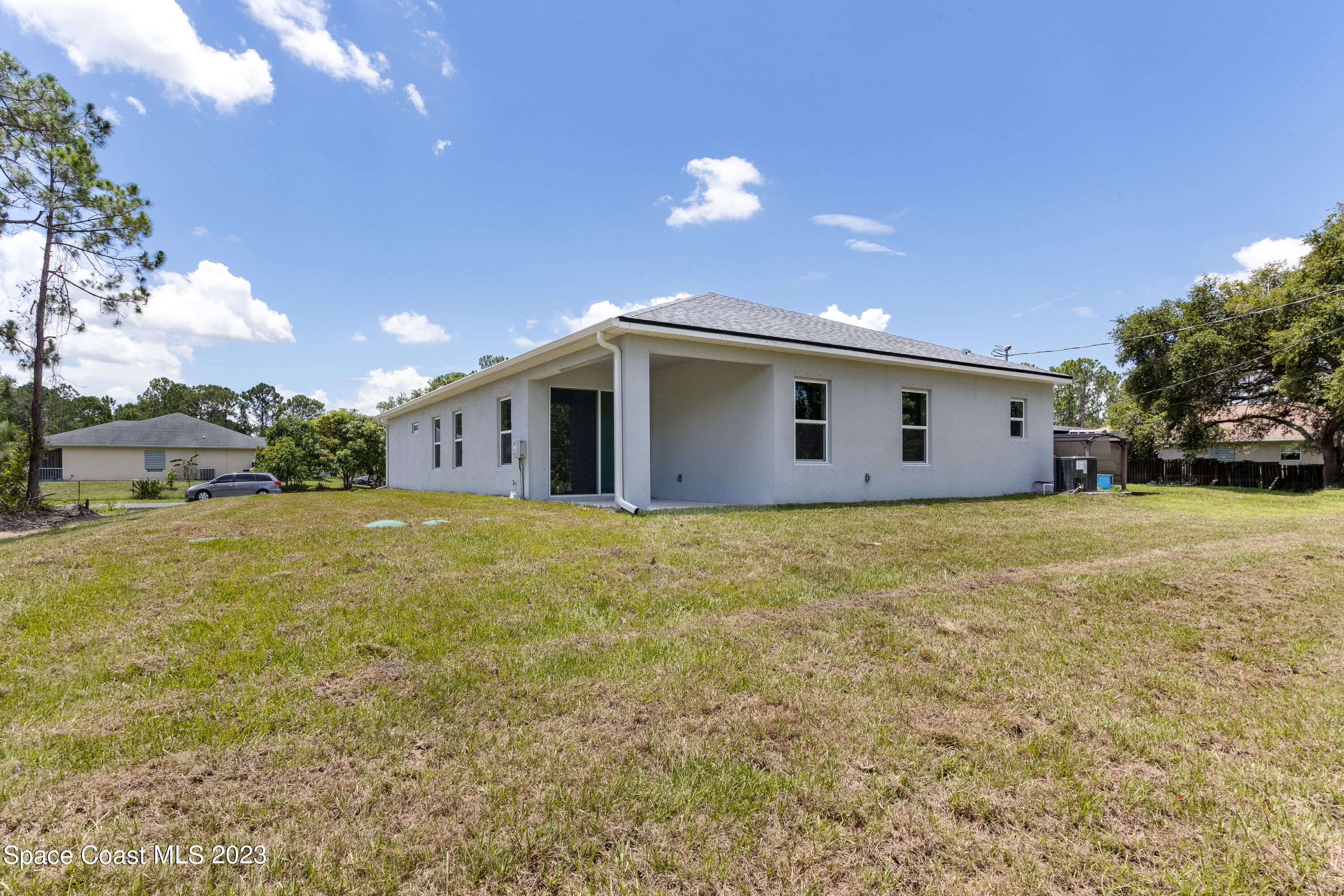 1007 San Rafael Road Southwest Palm Bay, FL 32908 - Photo 23 of 23 a view of a house with backyard and garden