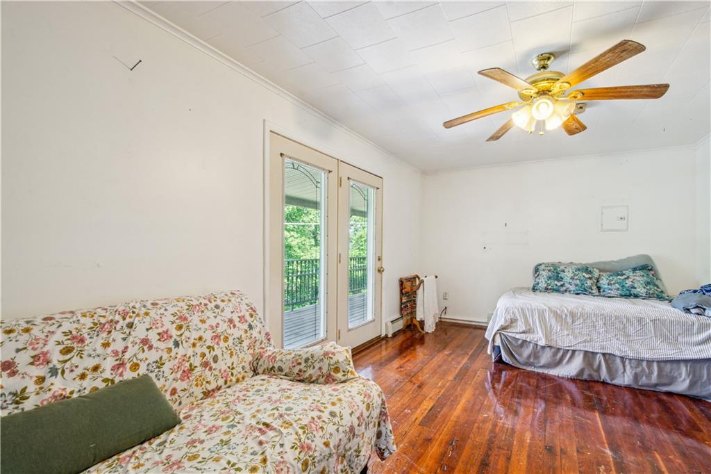 728 State Rte 1033 Templeton, PA 16259 - Photo 26 of 49 a bedroom with a bed and wooden floor