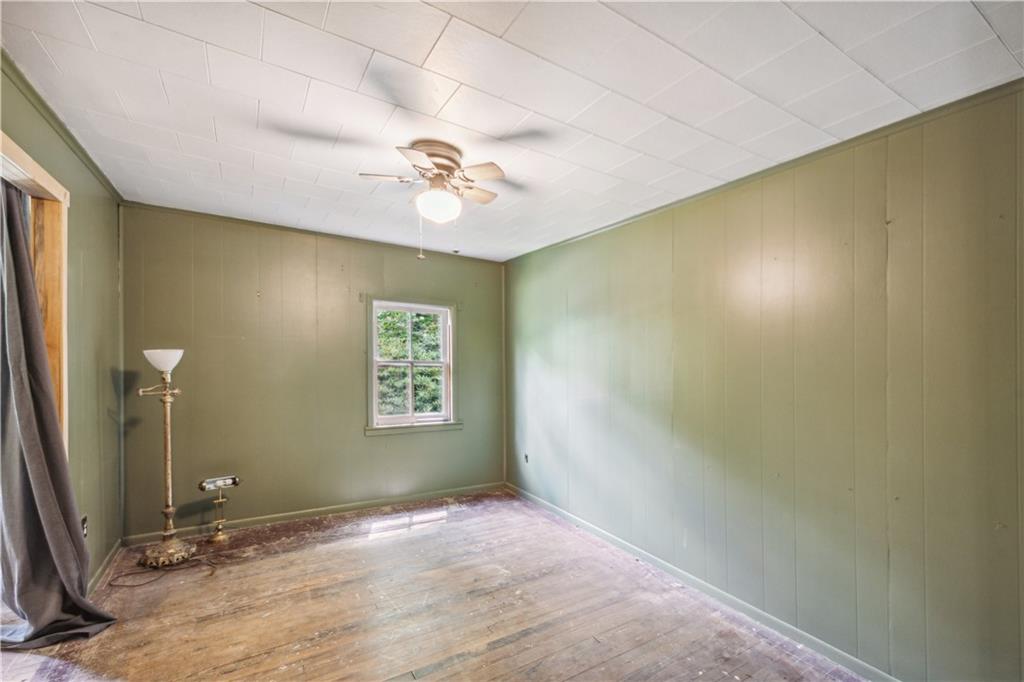 728 State Rte 1033 Templeton, PA 16259 - Photo 34 of 49 a view of a livingroom with a chandelier fan and a wooden floor