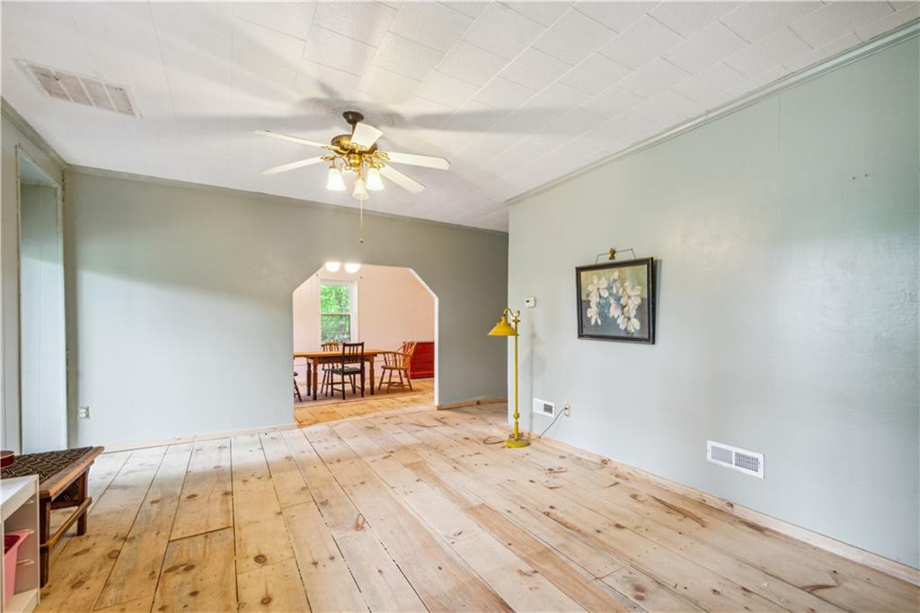 728 State Rte 1033 Templeton, PA 16259 - Photo 41 of 49 a view of a bedroom with a bed and a chandelier