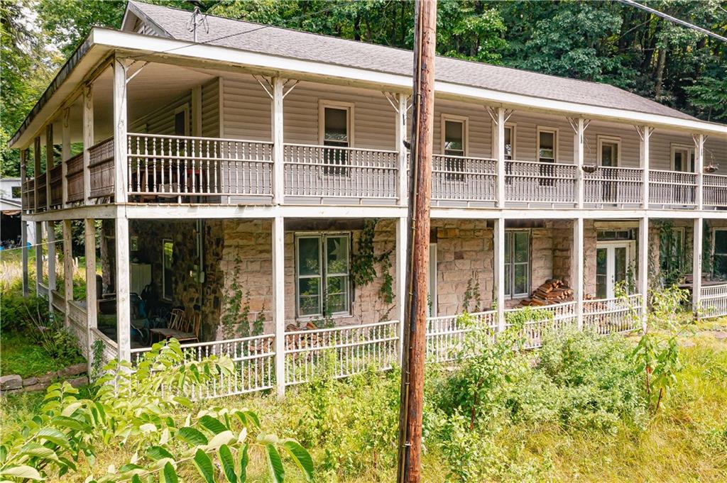 728 State Rte 1033 Templeton, PA 16259 - Photo 6 of 49 a view of a house with a large window and flower plants