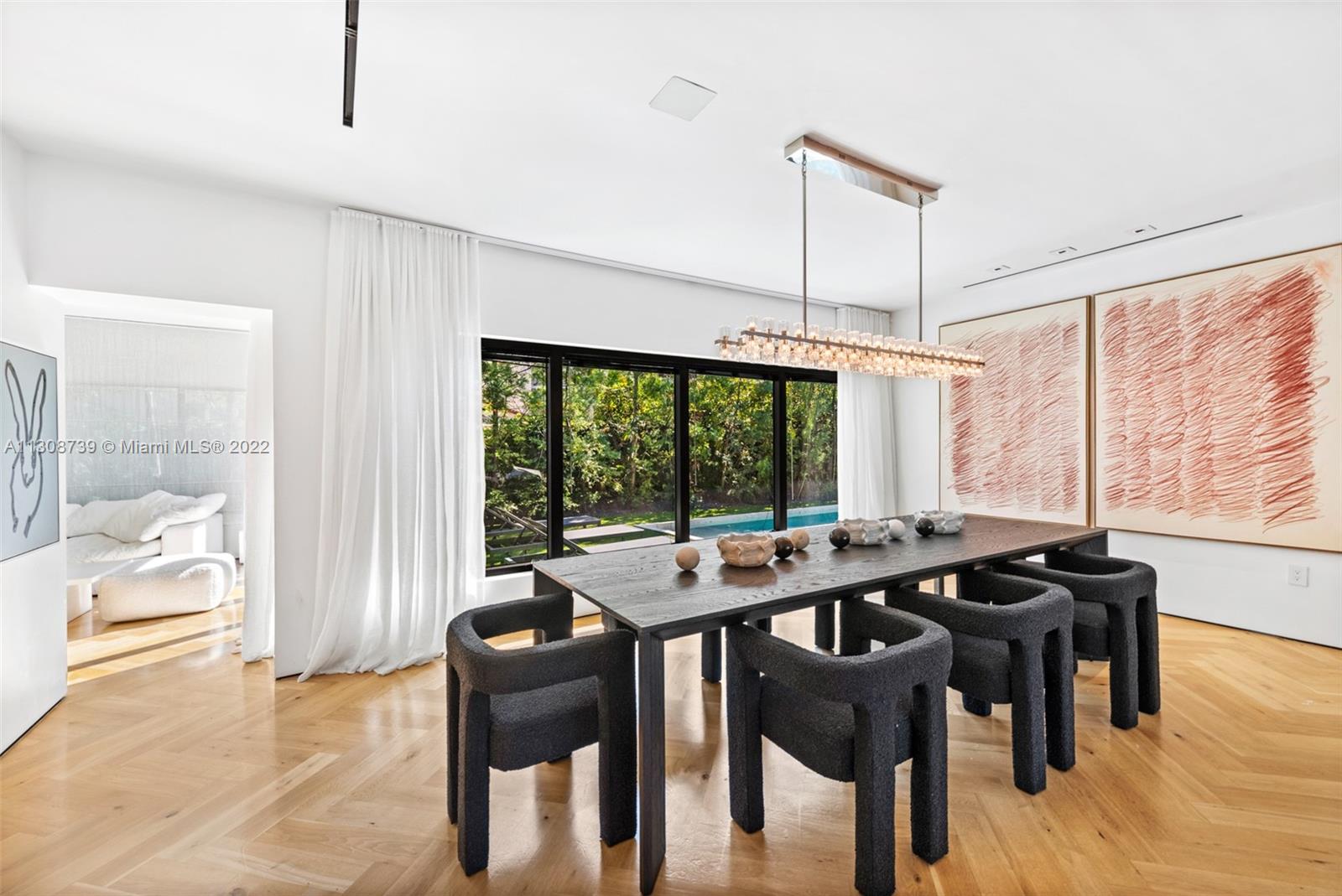 2021 North Bay Road Miami Beach, FL 33140 - Photo 13 of 38 a view of a dining room with furniture window and outside view