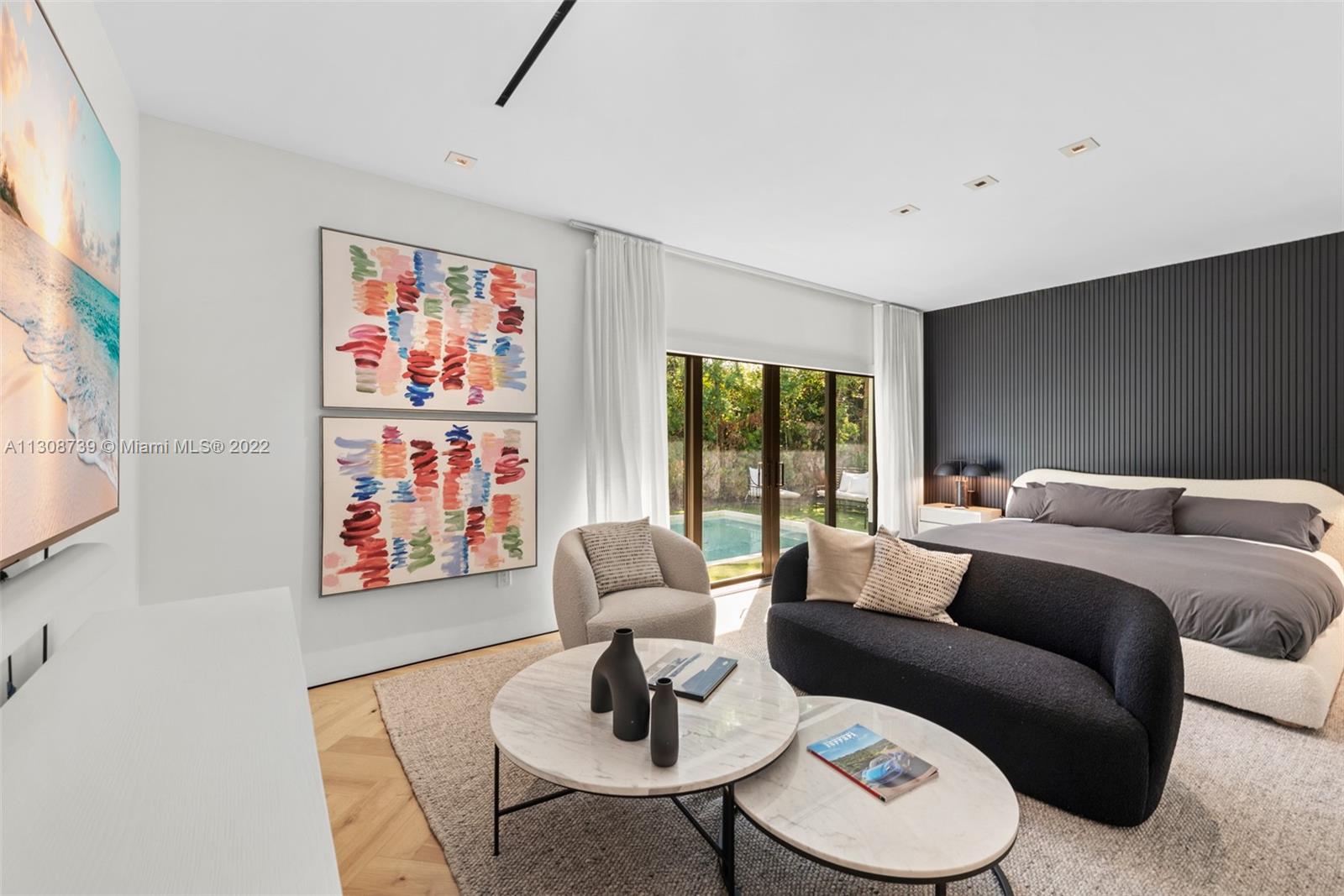 2021 North Bay Road Miami Beach, FL 33140 - Photo 23 of 38 a living room with furniture and a table