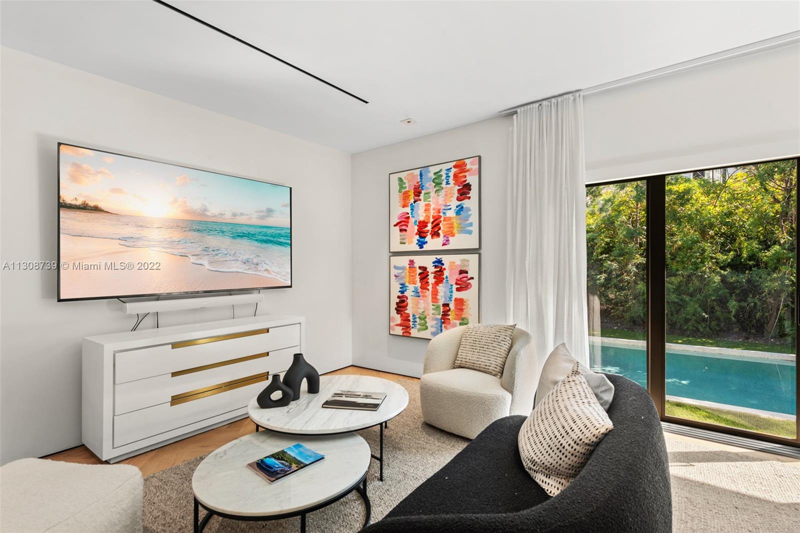 2021 North Bay Road Miami Beach, FL 33140 - Photo 25 of 38 a living room with furniture and a wooden floor