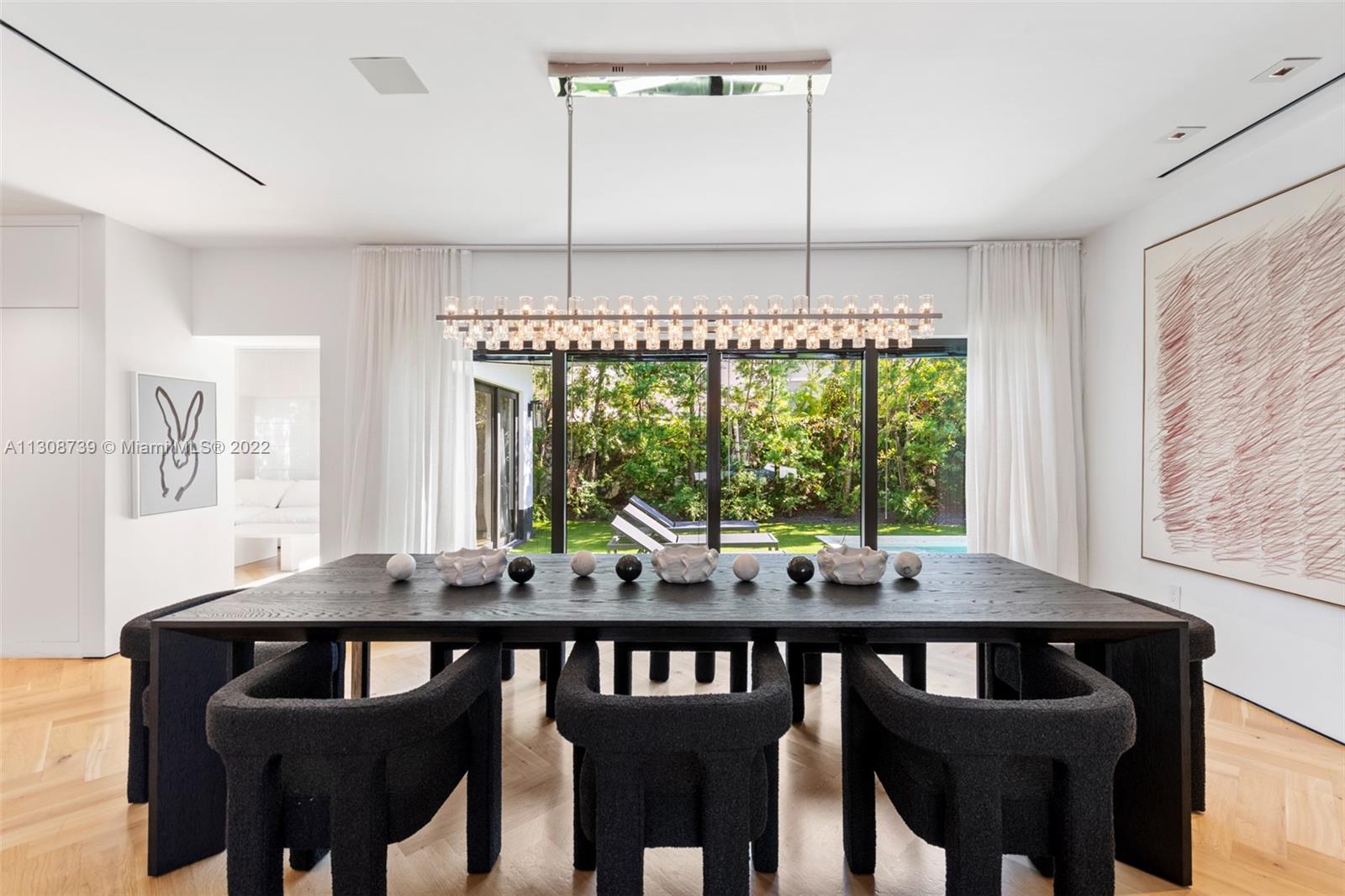 2021 North Bay Road Miami Beach, FL 33140 - Photo 4 of 38 a view of a dining room with furniture window and outside view
