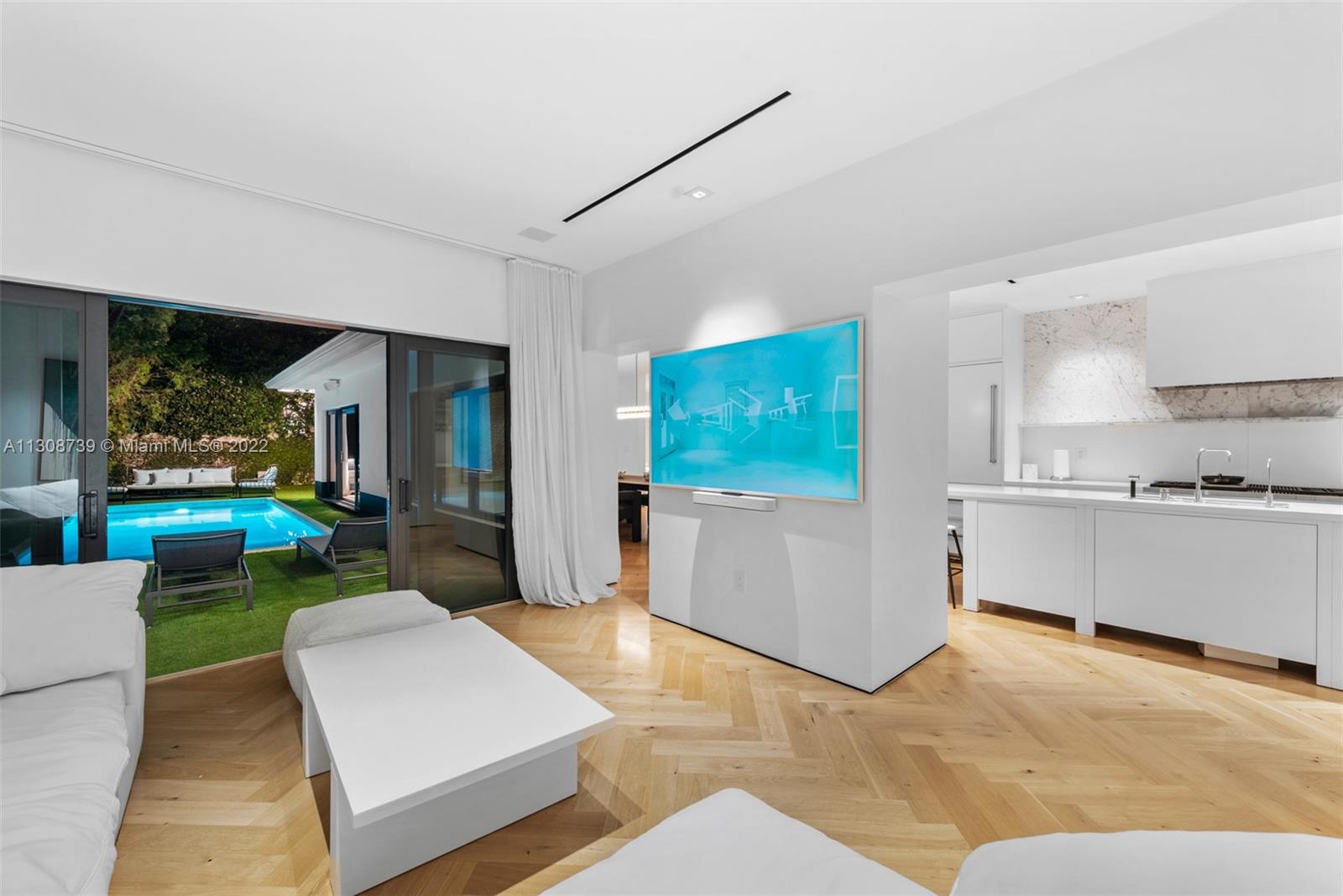 2021 North Bay Road Miami Beach, FL 33140 - Photo 6 of 38 a living room with furniture and a flat screen tv