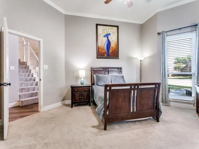 a bedroom with a bed and furniture