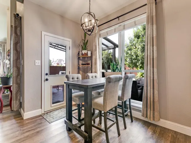 a dining room with furniture window wooden floor