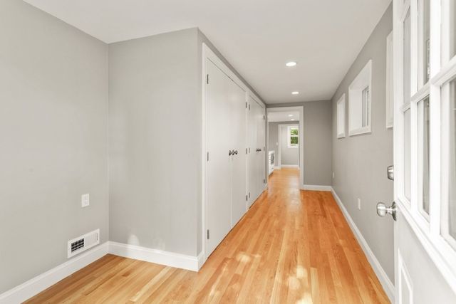 a view of a room with wooden floor and staircase
