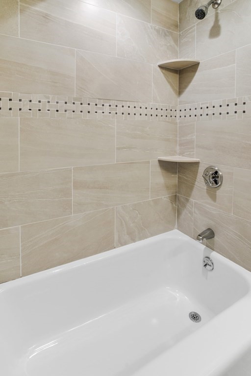 11 Allison Road Saugus, MA 01906 - Photo 16 of 28 a bathroom with a bathtub