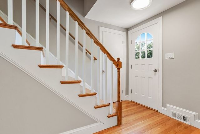 a view of an entryway with wooden floor