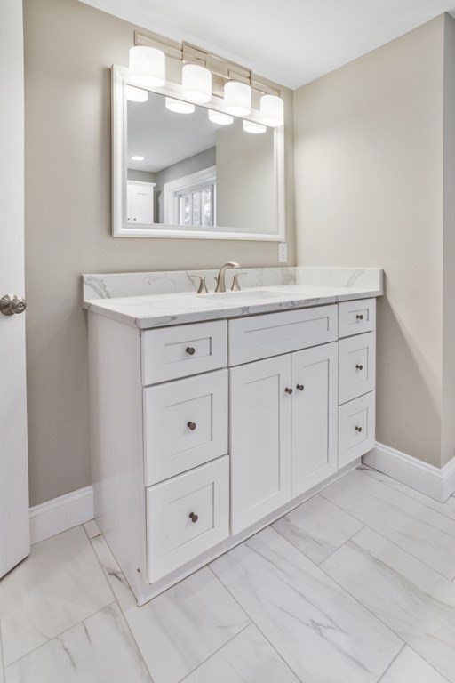 11 Allison Road Saugus, MA 01906 - Photo 22 of 28 a bathroom with a sink and a mirror