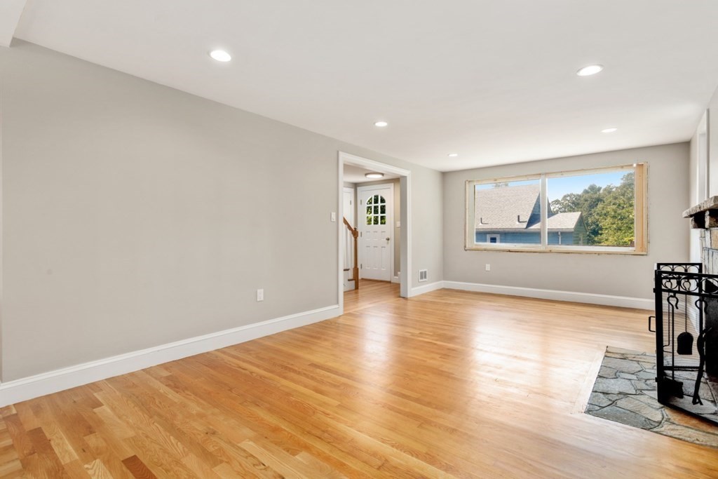 11 Allison Road Saugus, MA 01906 - Photo 10 of 28 a view of empty room with wooden floor and fan