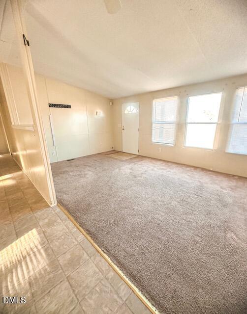 7537 Sam Young Road Oxford, NC 27565 - Photo 11 of 28 an empty room with windows